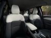 Looking toward the rear seats of the 2026 Mazda CX-5 from the passenger side, showcasing interior space.